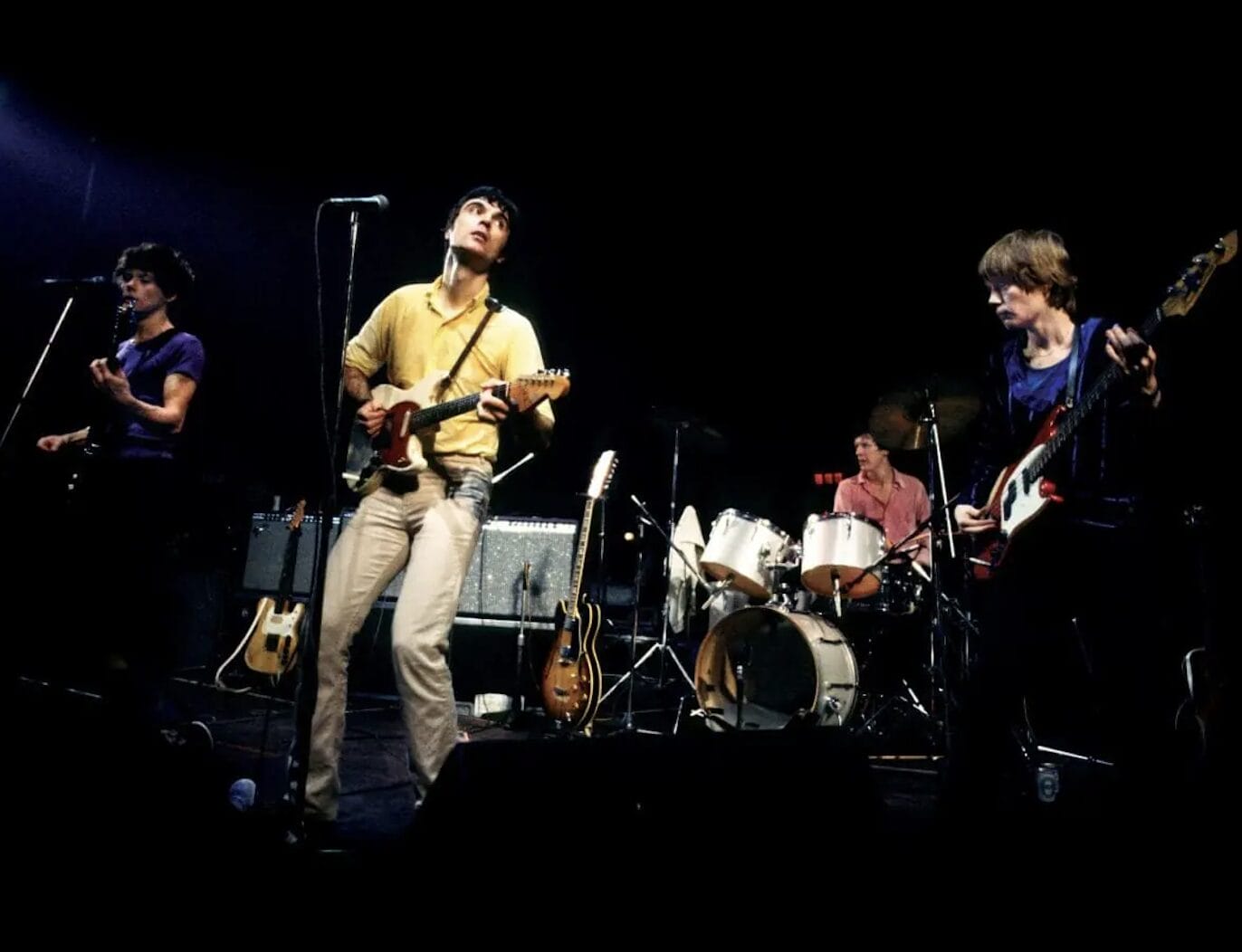 “How Did We Get Here?”: Talking Heads Tease 50th Anniversary Date